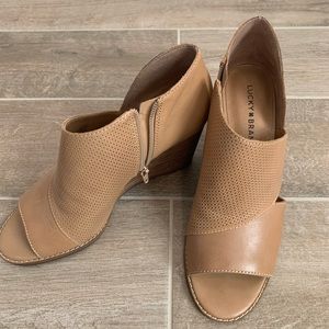 Brown lucky brand wedges with open toe.